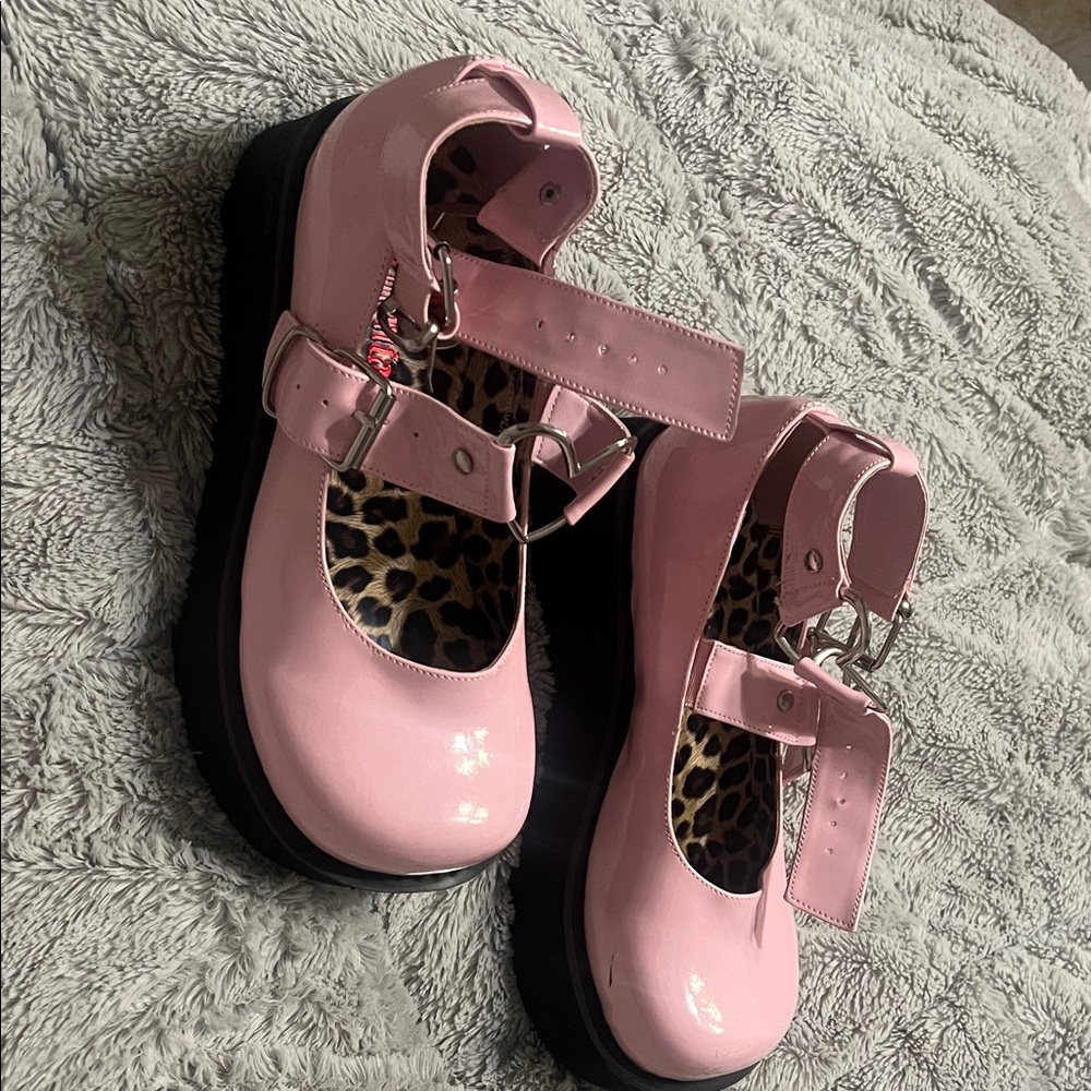 Pink women’s demonia Shoes with heart Buckle Straps. Size 8. Rarely worn.